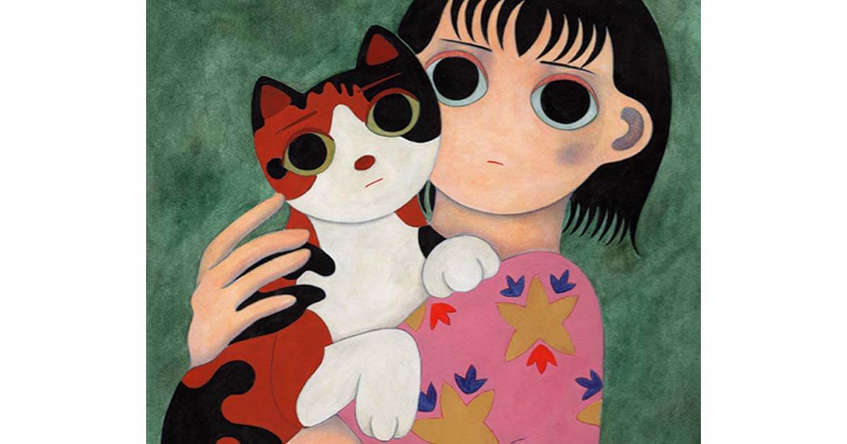 三毛猫を抱く女の子